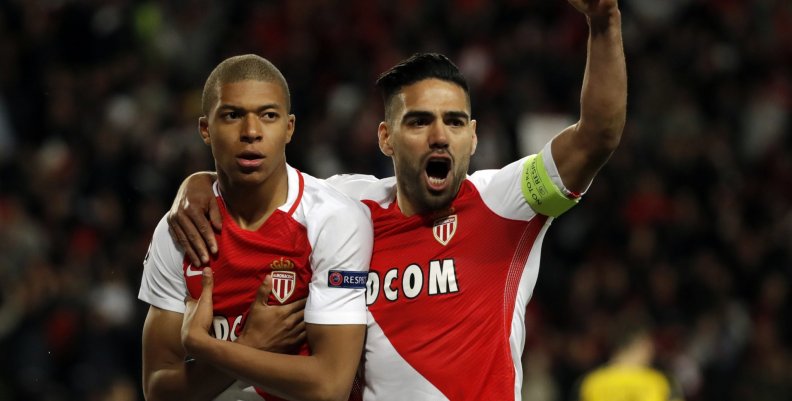 Monaco's Kylian Mbappe-Lottin celebrates scoring their first goal with Radamel Falcao