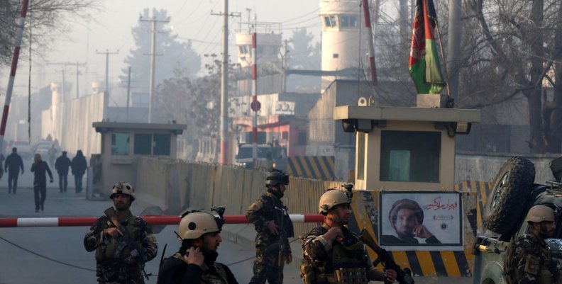 Afghan security forces keep watch at a check point close to compound of Afghanistan's national intelligence agency in Kabul, Afghanistan