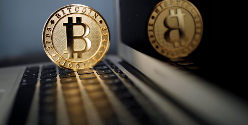 FILE PHOTO: A Bitcoin (virtual currency) coin is seen in an illustration picture taken at La Maison du Bitcoin in Paris