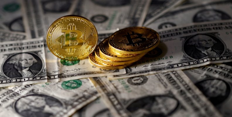 FILE PHOTO: Bitcoin (virtual currency) coins placed on Dollar banknotes are seen in this illustration picture