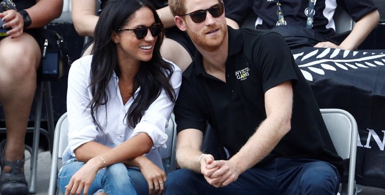 FILE PHOTO: Britain's Prince Harry sits with girlfriend actress Markle to watch a wheelchair tennis event during the Invictus Games in Toronto