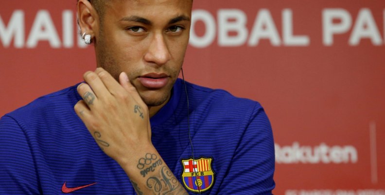 FILE PHOTO: FC Barcelona player Neymar attends a news conference in Tokyo