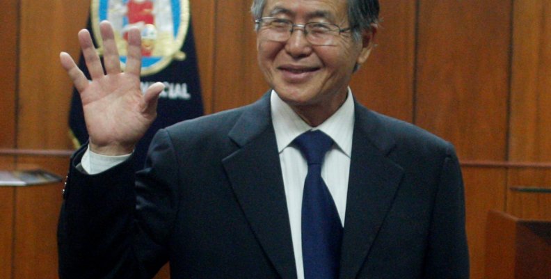 FILE PHOTO -  Peru's former President Alberto Fujimori waves as he enters the courtroom before his trial at the Special Police Headquarters in Lima