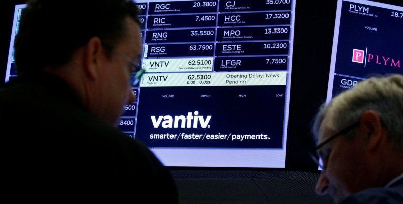 FILE PHOTO:Traders wait for news at the post where U.S. credit card technology firm Vantiv Inc is traded on the floor of the NYSE in New York FILE PHOTO:Traders wait for news at the post where U.S. credit card technology firm Vantiv Inc is traded on the floor of the NYSE in New York