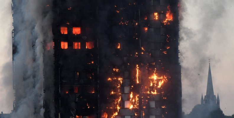 Flames and smoke engulf a tower block, in north Kensington, West London