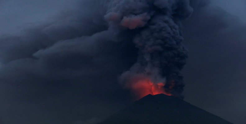 Glowing light of hot lava is seen during the eruption of Mount Agung as seen from Amed in Karangasem