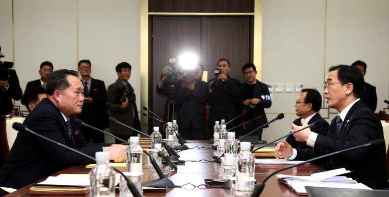 Head of the North Korean delegation, Ri Son Gwon talks with South Korean counterpart Cho Myoung-gyon during their meeting at the truce village of Panmunjom