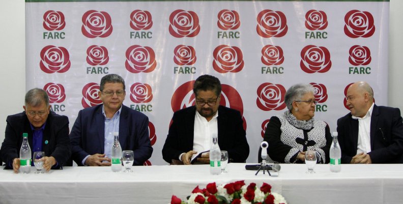 Members of the political party of the FARC look on during the presentation of their candidates in Bogota