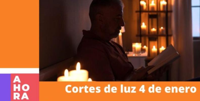 En la imagen se observa a un hombre leyendo en su apartamento a la luz de velas. 