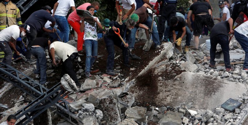 People remove debris after earthquake hit Mexico City People remove debris after earthquake hit Mexico City