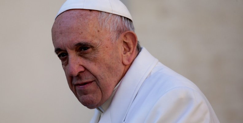 Pope Francis looks on as he arrives to lead the Wednesday general audience in Saint Peter's square at the Vatican