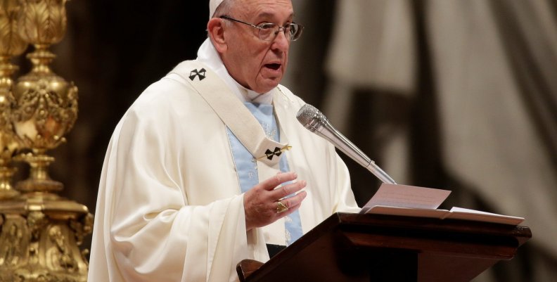 Pope Francis speaks as he leads a mass to mark the World Day of Peace in Saint Peter's Basilica at the Vatican