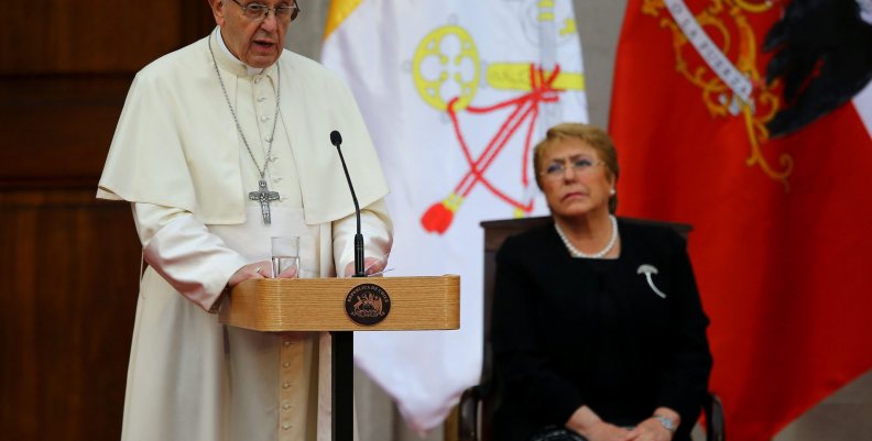 Pope Francis speaks next to Chile's President Michelle Bachelet at the La Moneda Presidential Palace in Santiago,