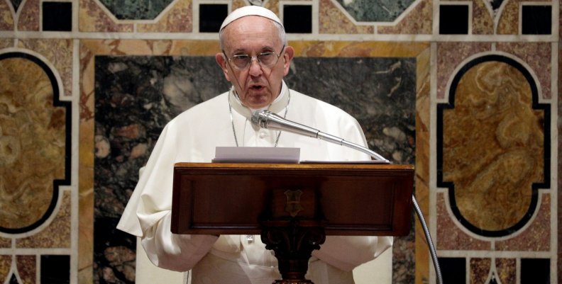 Pope Francis talks to diplomats during the traditional exchange of the New Year greetings in the Regal Room at the Vatican