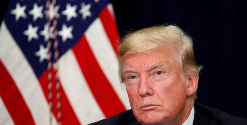 U.S. President Donald Trump attends a briefing on hurricane recovery efforts in Dallas, Texas