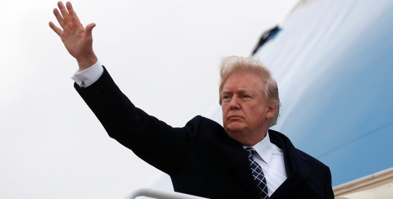 U.S. President Donald Trump waves as he boards Air Force One upon departure from Joint Base Andrews in Maryland