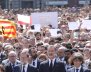 King Felipe of Spain sits between Prime Minister Mariano Rajoy and President of the Generalitat of Catalonia Carles Puigdemont as they observe a minute of silence in Placa de Catalunya in Barcelona