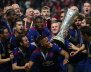 Manchester United's Wayne Rooney and team mates celebrate with the trophy after winning the Europa League