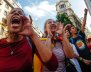 Women shout slogans against Spanish National Police during a gathering outside a National Police station, in Barcelona