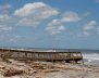 Women walk on a damaged beach access ramp after Hurricane Irma passed the area in Ponte Vedra Beach