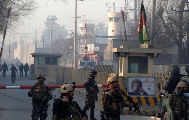 Afghan security forces keep watch at a check point close to compound of Afghanistan's national intelligence agency in Kabul, Afghanistan