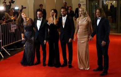 Argentine soccer player Lionel Messi's former Barcelona FC teammates and their wives pose for photographers as they arrive at the wedding of Messi and Antonela Roccuzzo in Rosario