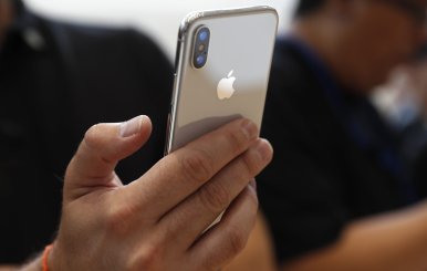 Attendee checks out new iPhone X during an Apple launch event in Cupertino