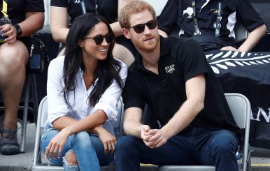 FILE PHOTO: Britain's Prince Harry sits with girlfriend actress Markle to watch a wheelchair tennis event during the Invictus Games in Toronto