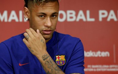 FILE PHOTO: FC Barcelona player Neymar attends a news conference in Tokyo