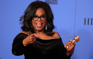 FILE PHOTO: Oprah Winfrey with her Cecil B. DeMille Award at the 75th Golden Globe Awards in Beverly Hills