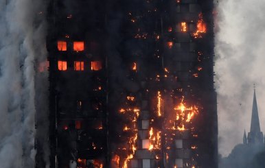 Flames and smoke engulf a tower block, in north Kensington, West London