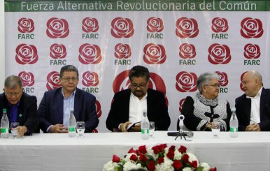 Members of the political party of the FARC look on during the presentation of their candidates in Bogota