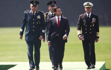 Mexico's President Enrique Pena Nieto participates with Mexico's Defense Minister General Salvador Cienfuegos and Mexico's Secretary of the Navy Admiral Vidal Francisco Soberon during Flag Day celebrations at Campo Marte in Mexico City