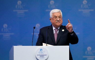 Palestinian President Mahmoud Abbas speaks during an extraordinary meeting of the OIC in Istanbul