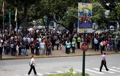 People gather in the street after an earthquake in Caracas