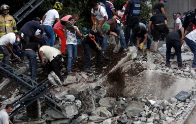 People remove debris after earthquake hit Mexico City