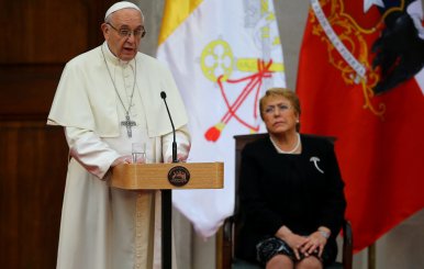 Pope Francis speaks next to Chile's President Michelle Bachelet at the La Moneda Presidential Palace in Santiago,