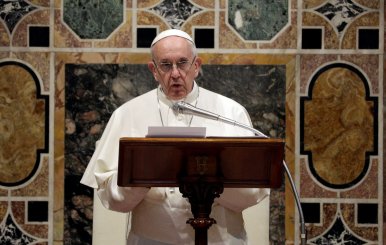 Pope Francis talks to diplomats during the traditional exchange of the New Year greetings in the Regal Room at the Vatican