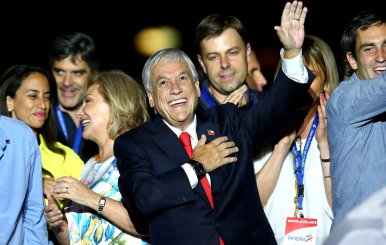 Presidential candidate Sebastian Pinera gestures after winning the presidential election, in Santiago, Chile