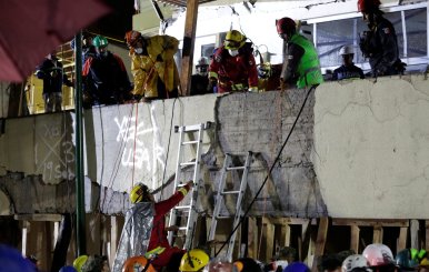 Rescue workers are seen during a search for students at the Enrique Rebsamen school after an earthquake in Mexico City
