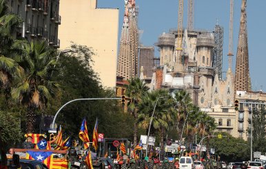 Tractors drive near the Sagrada Familia cathedral during a protest in favour of the banned referendum on independence from Spain in Barcelona