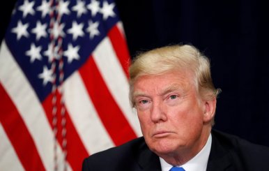 U.S. President Donald Trump attends a briefing on hurricane recovery efforts in Dallas, Texas