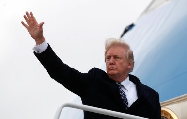 U.S. President Donald Trump waves as he boards Air Force One upon departure from Joint Base Andrews in Maryland