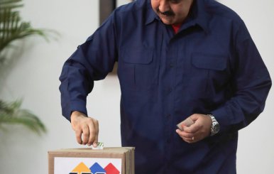 Venezuela's President Nicolas Maduro casts his vote at a polling station during a nationwide election for new mayors, in Caracas